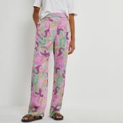 Pantalón fluido de satén con estampado floral